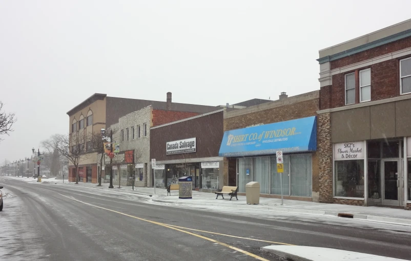 this is the empty town street that people are walking down