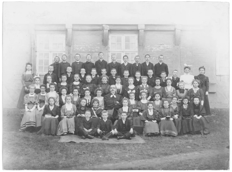 a school portrait of several teachers and young students