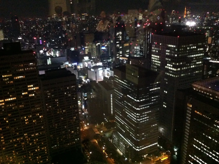 city skyline seen from a height high up at night