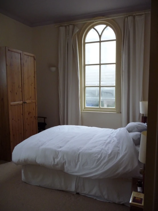 a bed in front of a window with the view