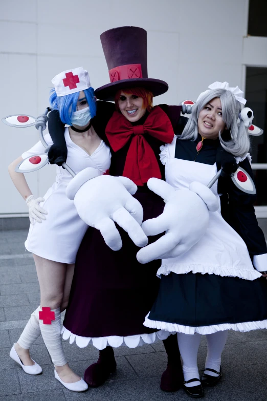 three people dressed up in costumes posing for the camera