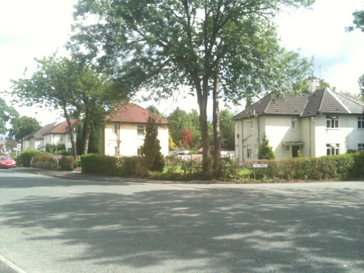 two large white houses sitting along side of each other