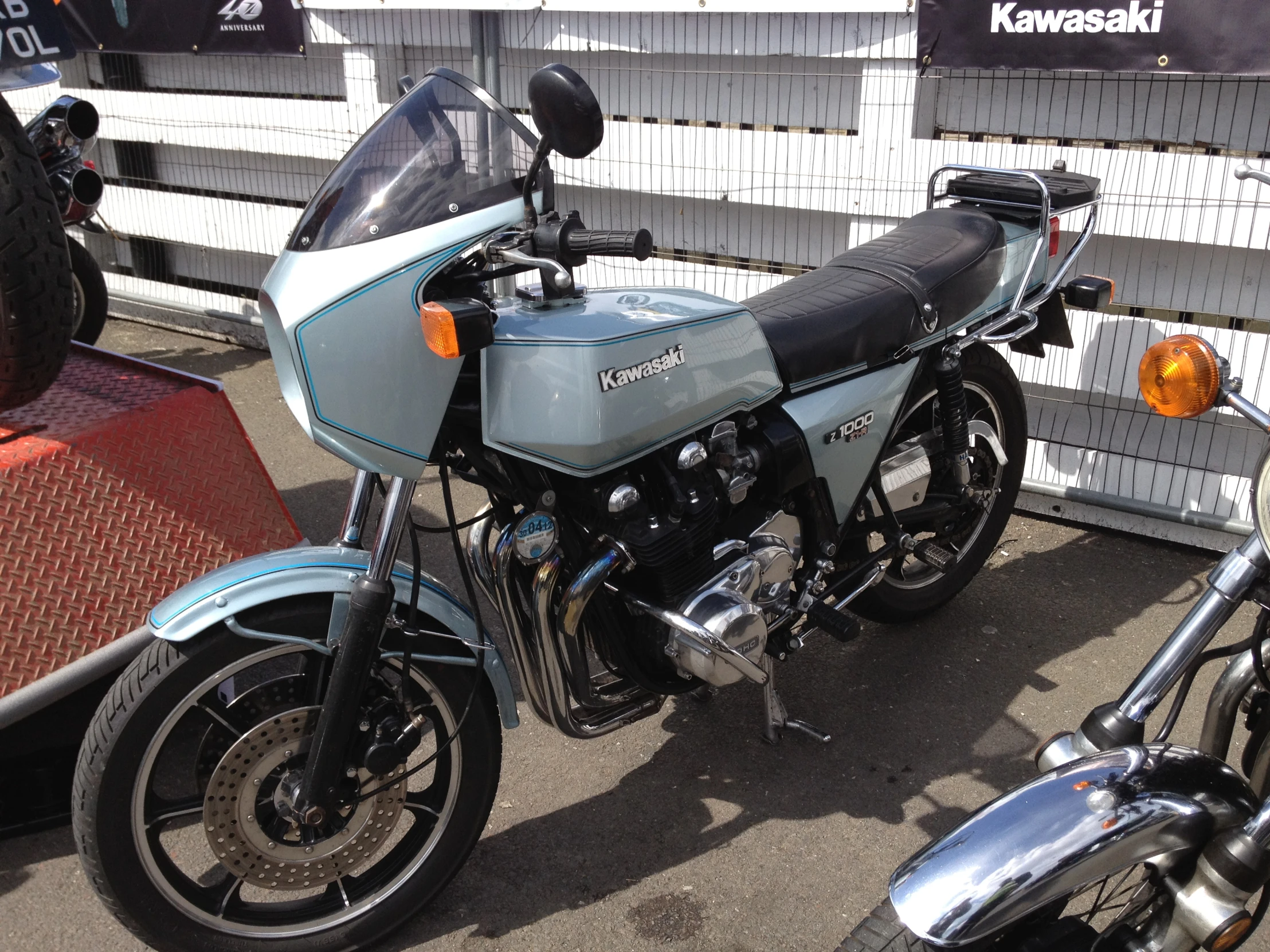 a motorcycle parked on the road next to another bike