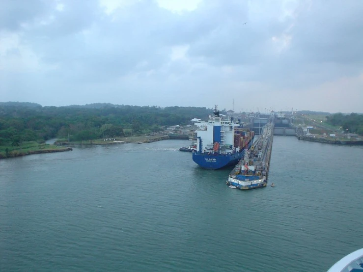 two ships are anchored to one another in a harbor