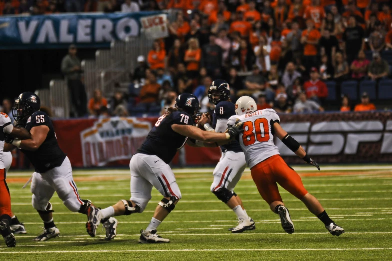 a group of football players playing on a field