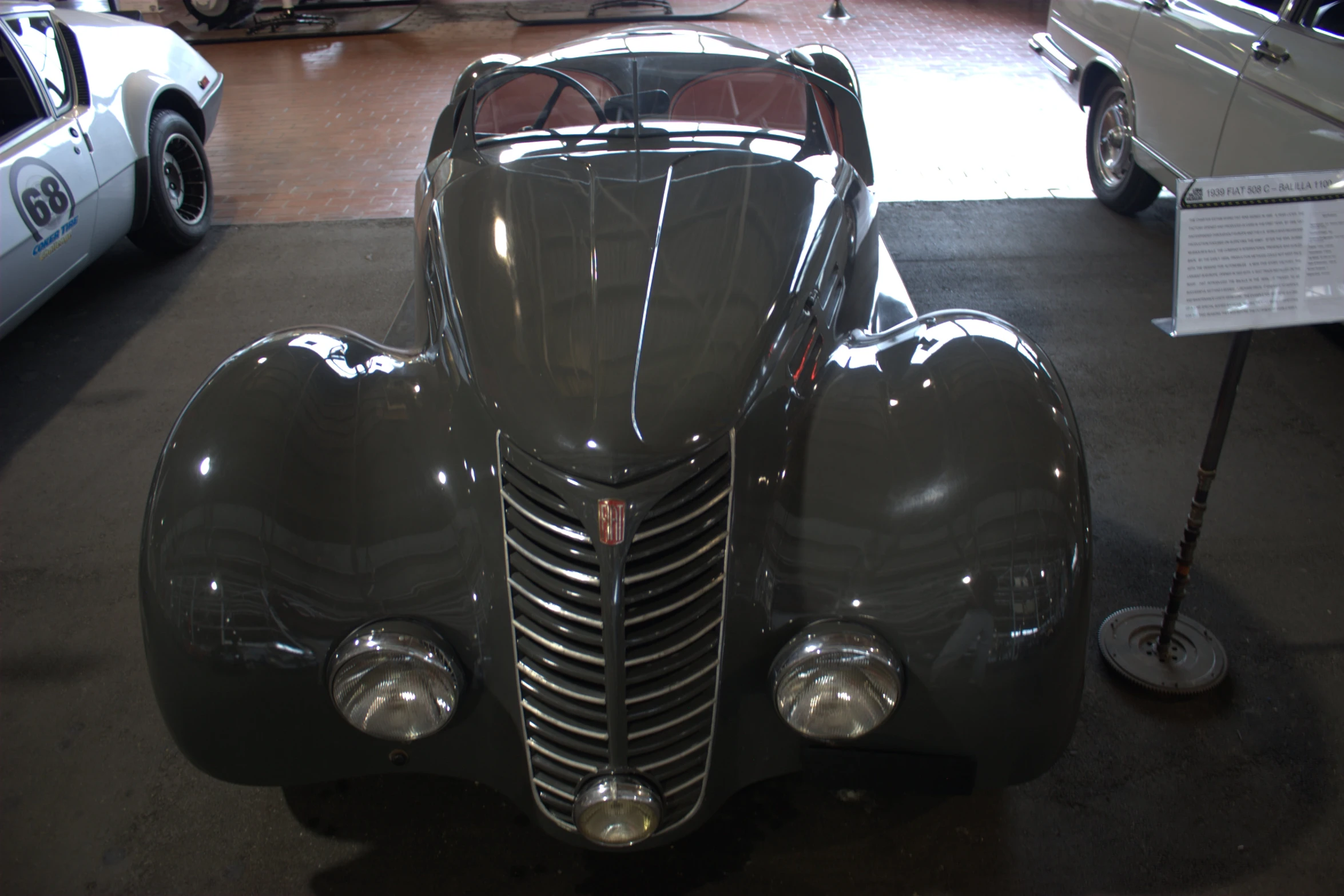 an antique car is parked inside a showroom