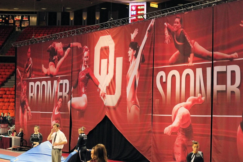 an advertit showing women's competitive wrestling at a sporting event