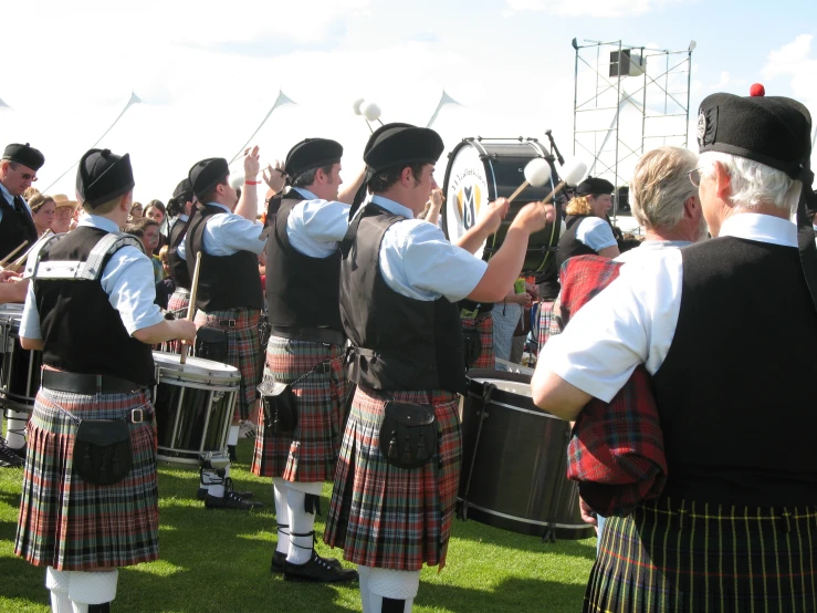 an irish band with musical instruments on green grass