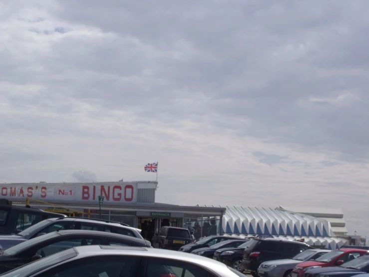 several cars parked next to each other in front of a building