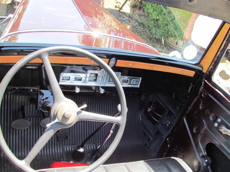 dashboard and controls of an old fashioned car