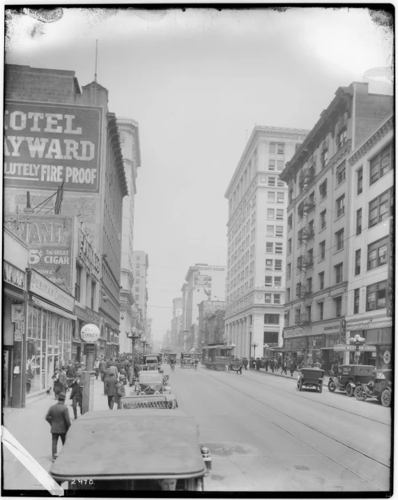 an old po shows people walking on the sidewalk