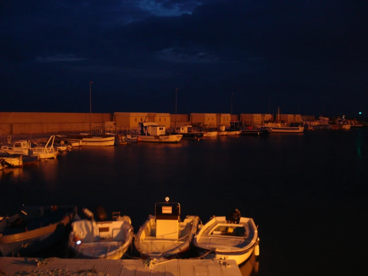boats at dock in the evening on a dark night