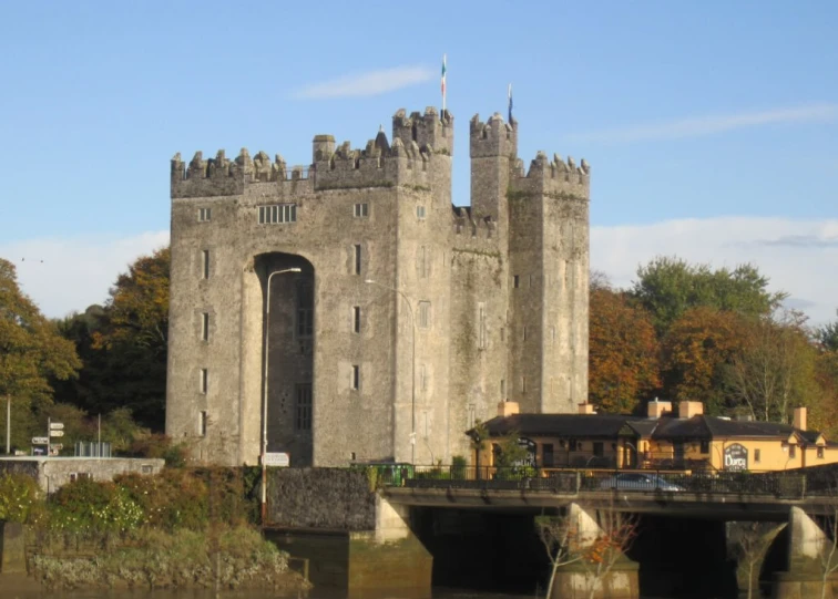 an old castle with a bridge going across it