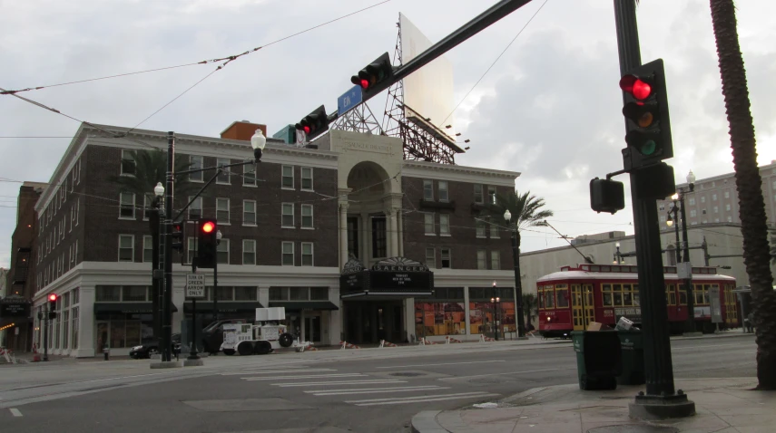 a traffic light is red with the building in the background