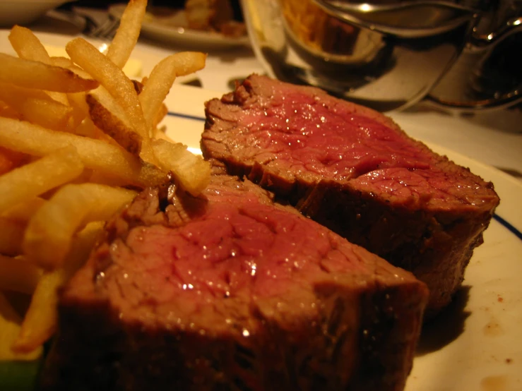 some steak with fries are on the plate