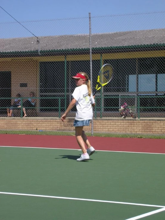 a woman on a court with a racket