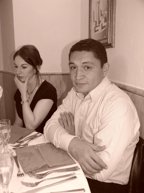 a man and a woman sitting at a table