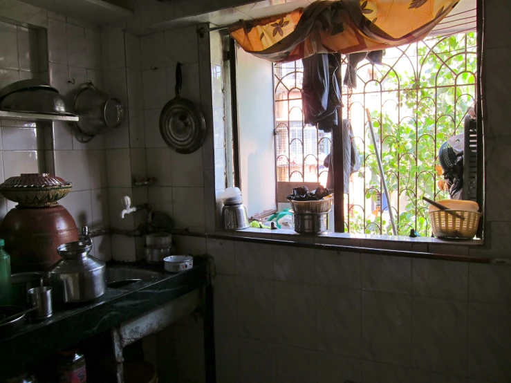 an empty kitchen with a curtain in front of it