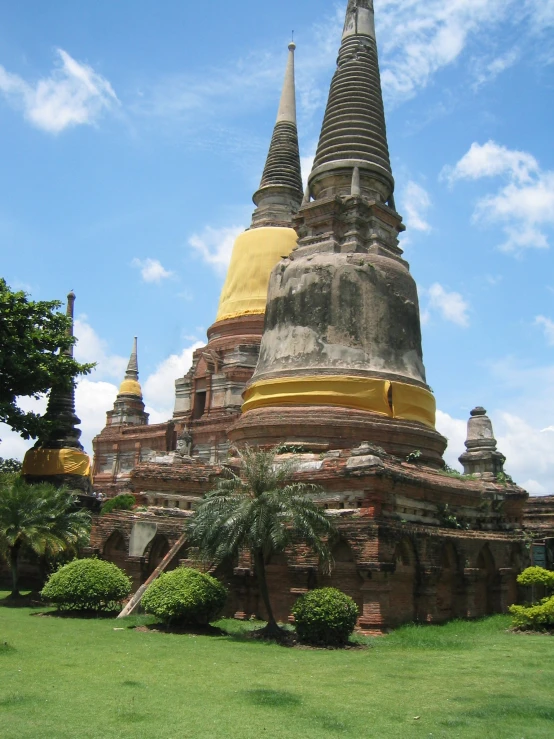 a large building made of stone with multiple spires on the top