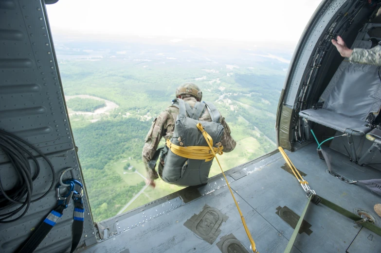 a man with a backpack in the air