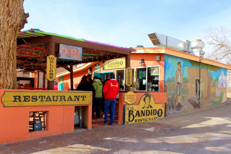 people at a restaurant that sells food and drinks