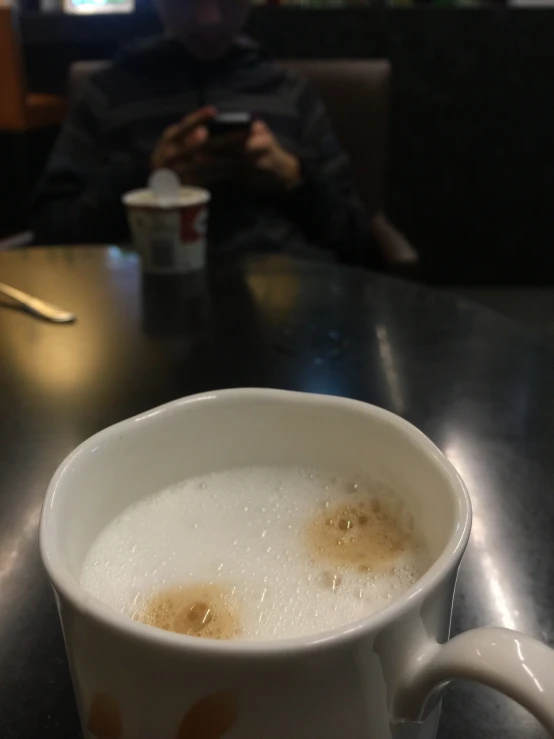 a mug of coffee with water on the inside and brown sugar on the outside