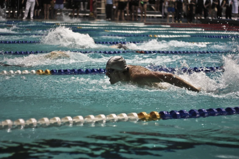 a group of swimmers in a swimming pool