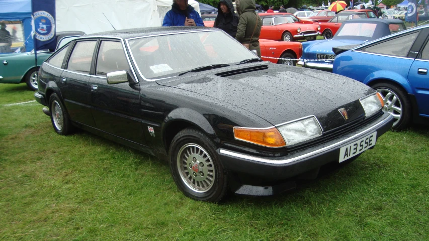 a very nice looking black car with its hood up