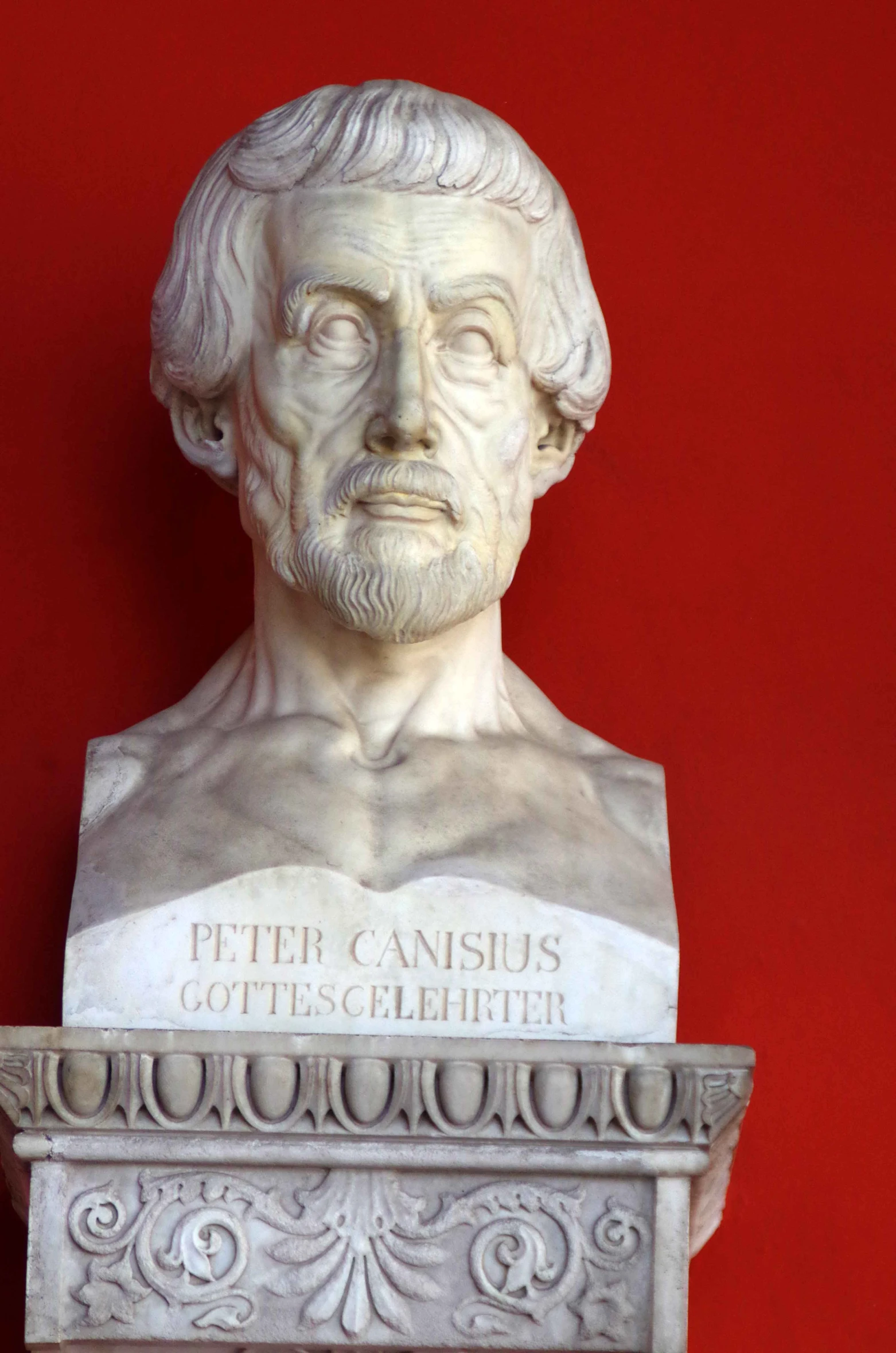 an antique bust of a man with white hair