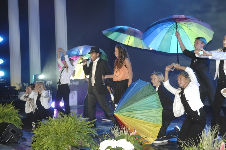 a bunch of people that are holding umbrellas