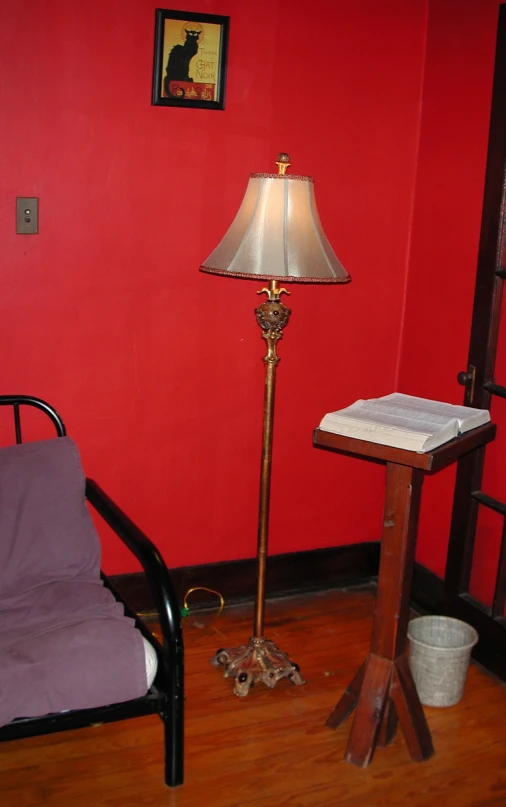 a lamp next to a lamp on top of a wooden table