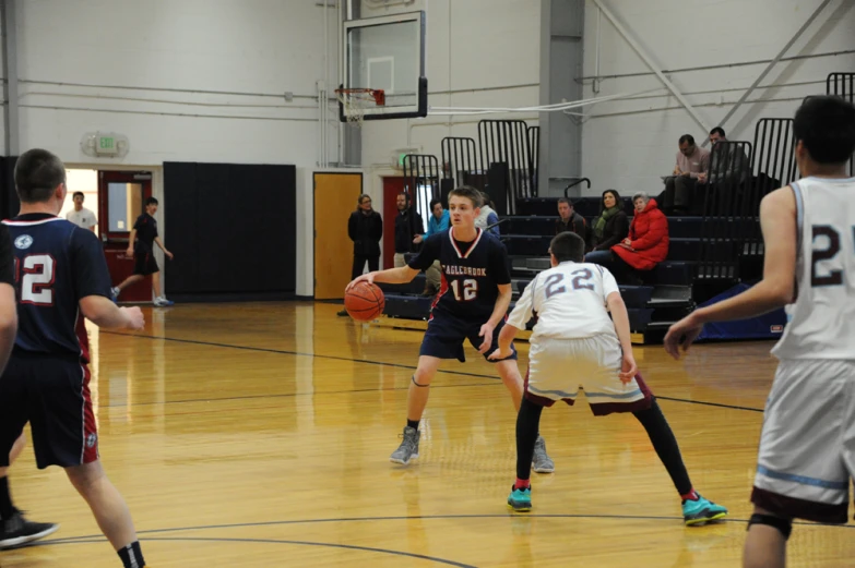 young basketball players during a game on an indoor court