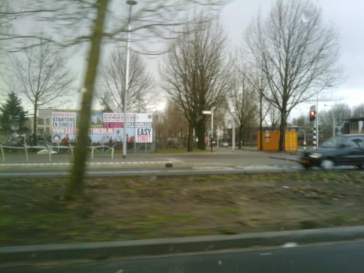 a car is coming toward the camera from a road intersection