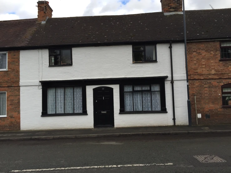 a white building with black trim on the side