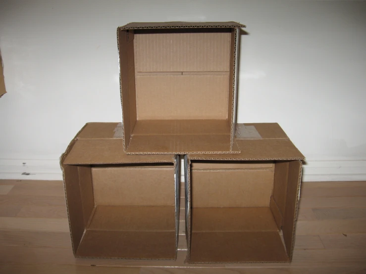 two boxes with a cardboard box in the middle