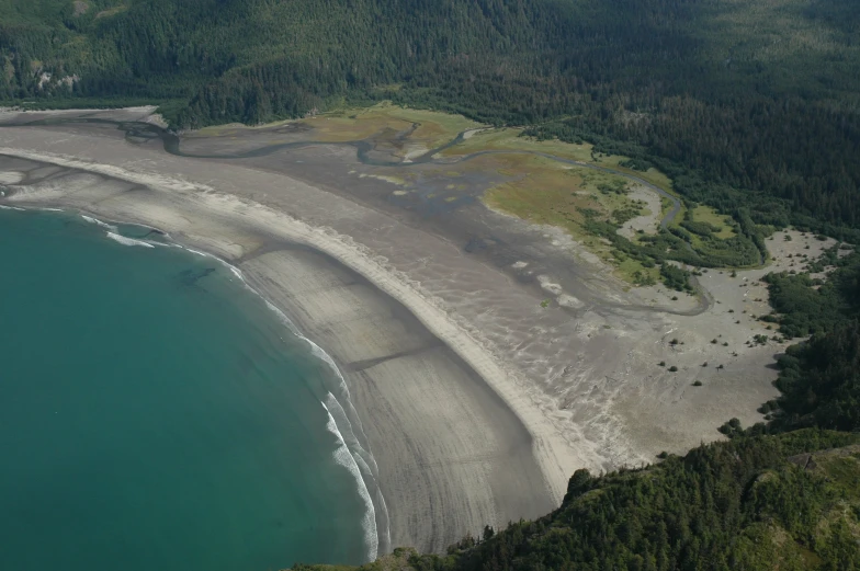 the view of a beach from an airplane