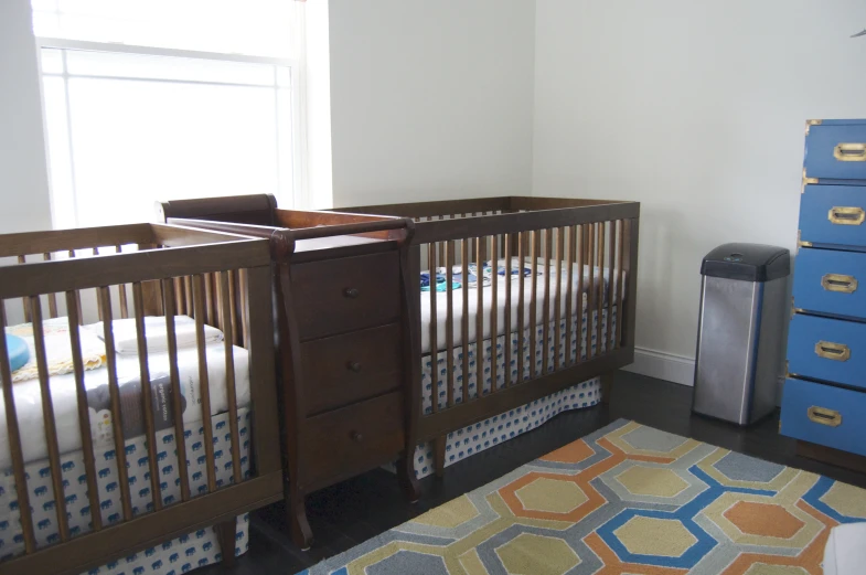 the small baby crib is empty and ready to be used