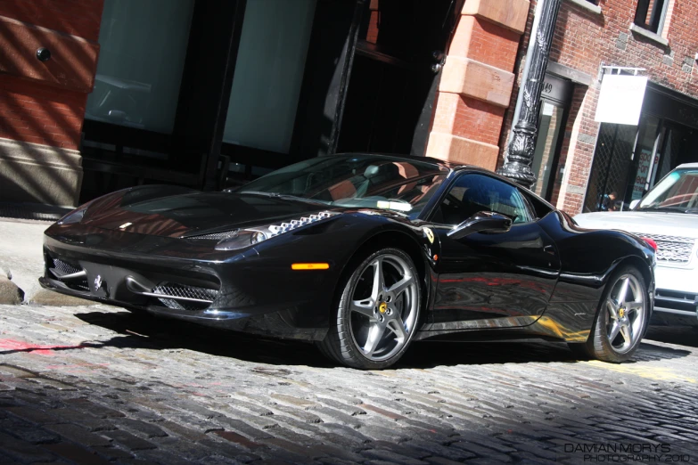 there is a black ferrari parked on the street