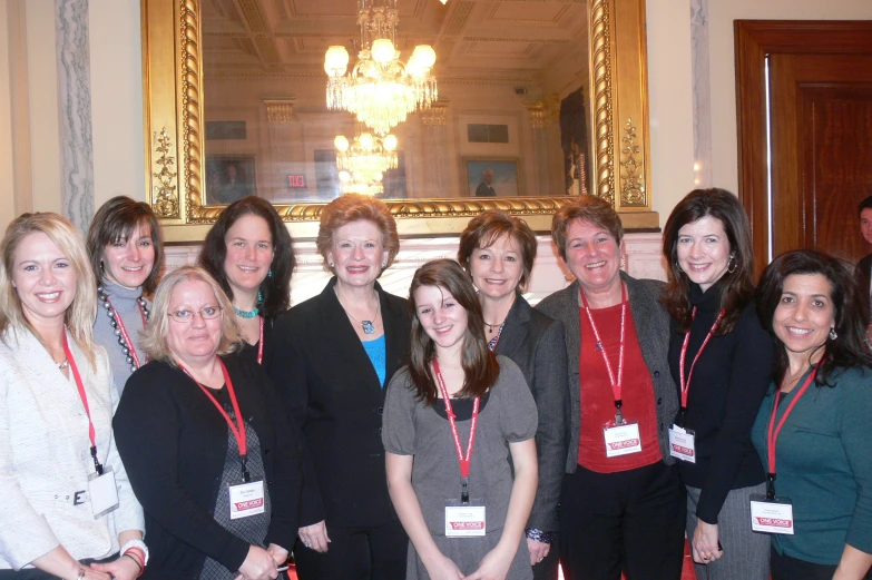 a group of people posing in a large room