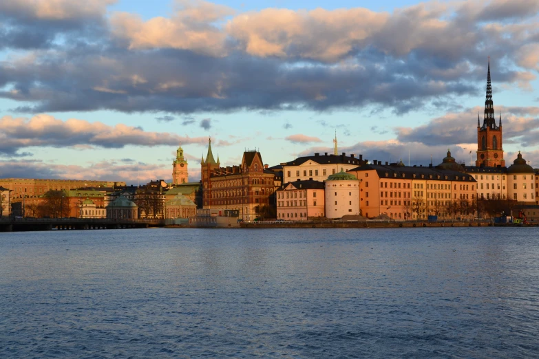 buildings at the waterfront of a city under stormy skies