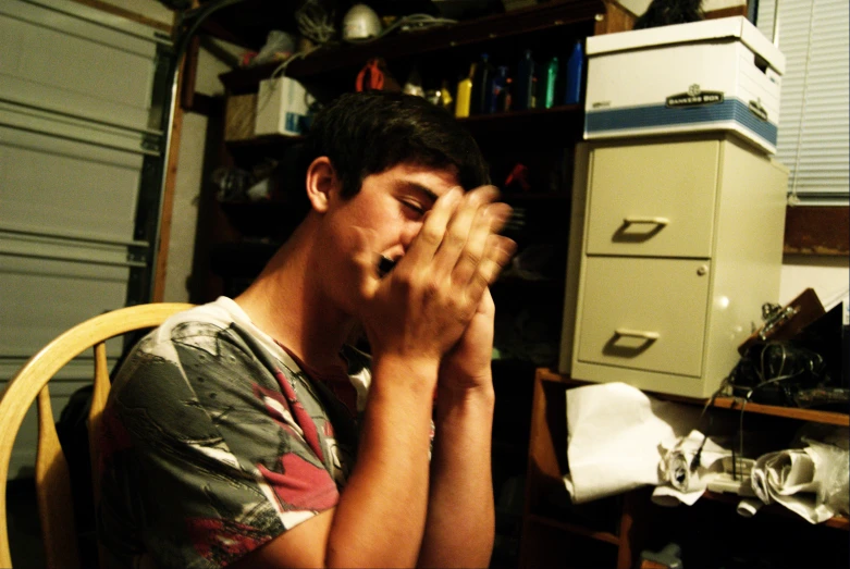 a man who is sitting in front of a computer