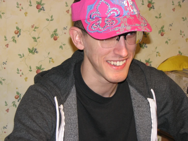 a close up view of a man wearing a hat