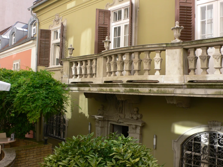 a house with a lot of windows and plants