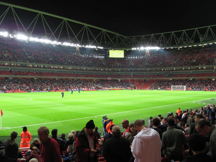 the inside view of an open air soccer stadium