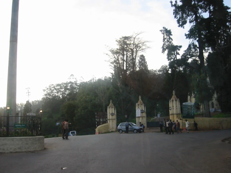 people gathered outside in front of large, ornate buildings