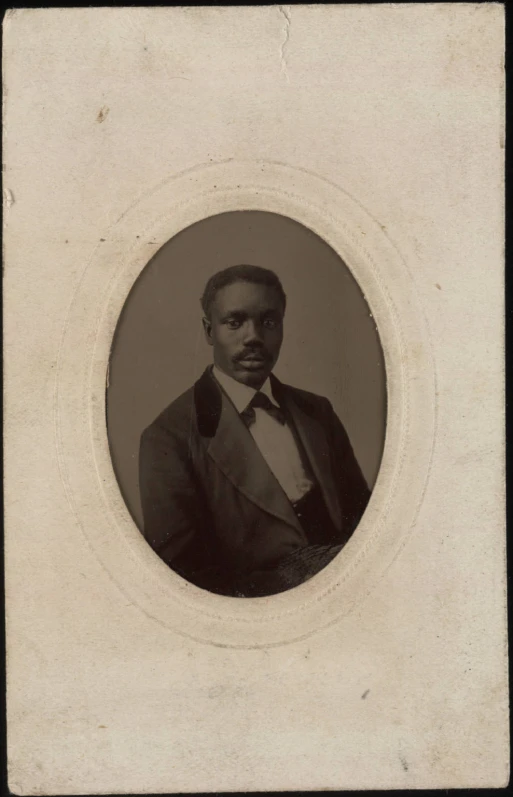 a portrait of a man in a suit and bow tie