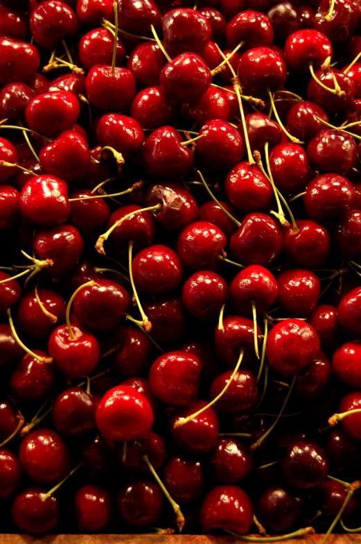 a pile of fresh cherries sitting next to each other