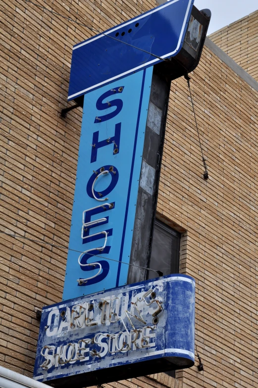 blue signage on a building for alcoholics