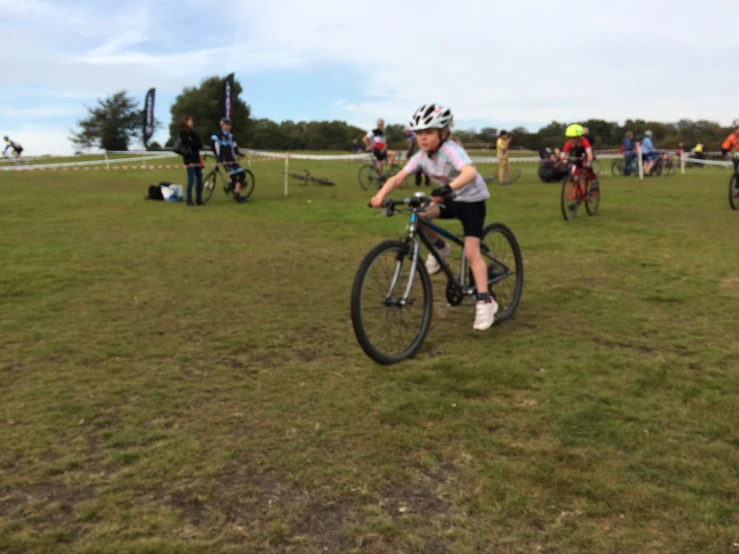 woman on a bicycle at an obstacle course