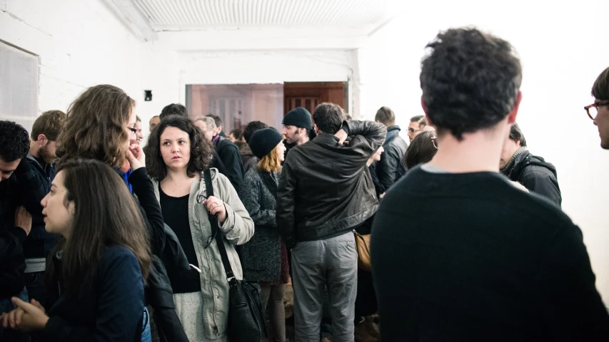 people in a room standing in a line